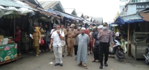 H. Murjani Turun Ke Pasar Sosialisasikan Penanggulangan Covid-19